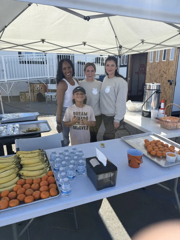 Orange Blossoms volunteers serving meals at The Hub in Orange, CA