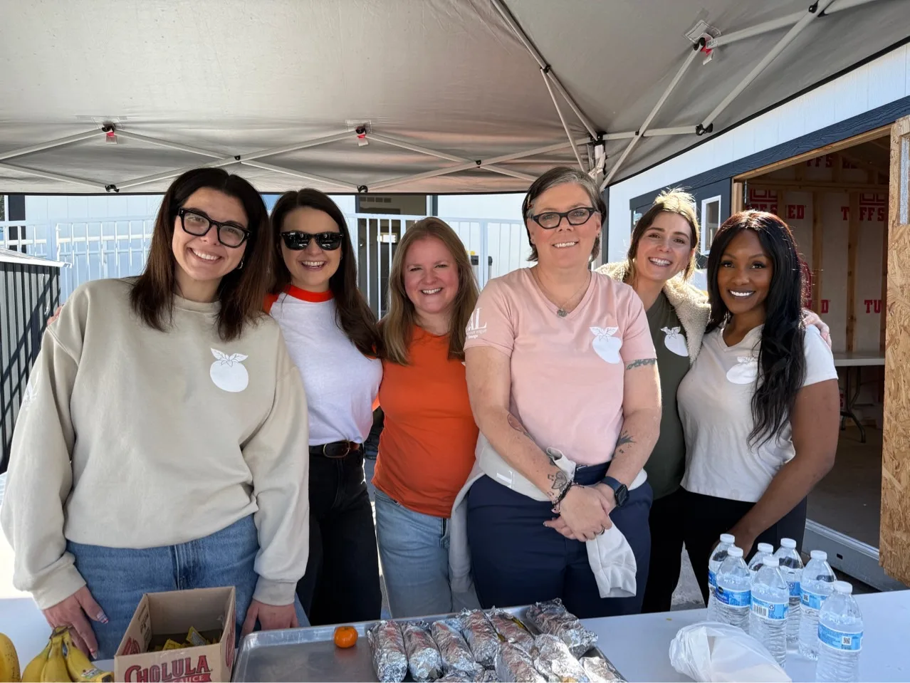 Orange Blossoms volunteers serving breakfast at The Hub in Orange, CA